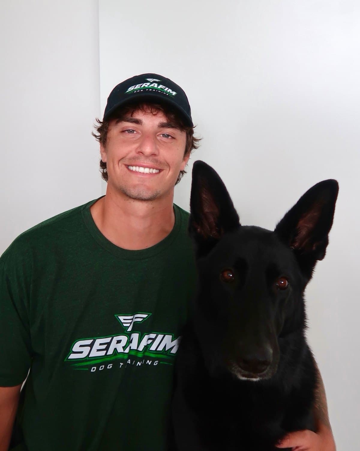 Arthur Serafim with Korra, his black German Shepherd service dog