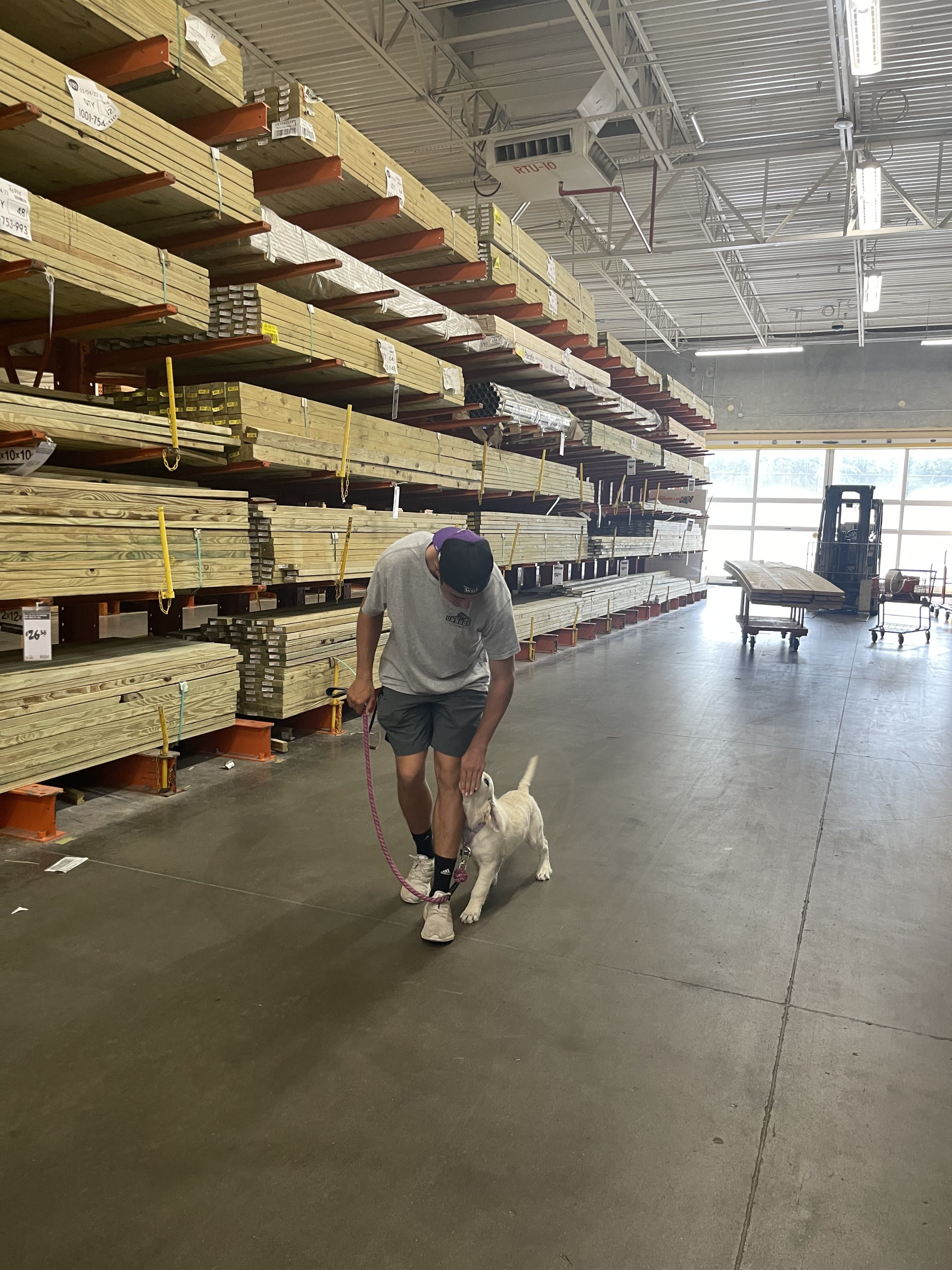 Arthur Serafim with a puppy at Home Depot